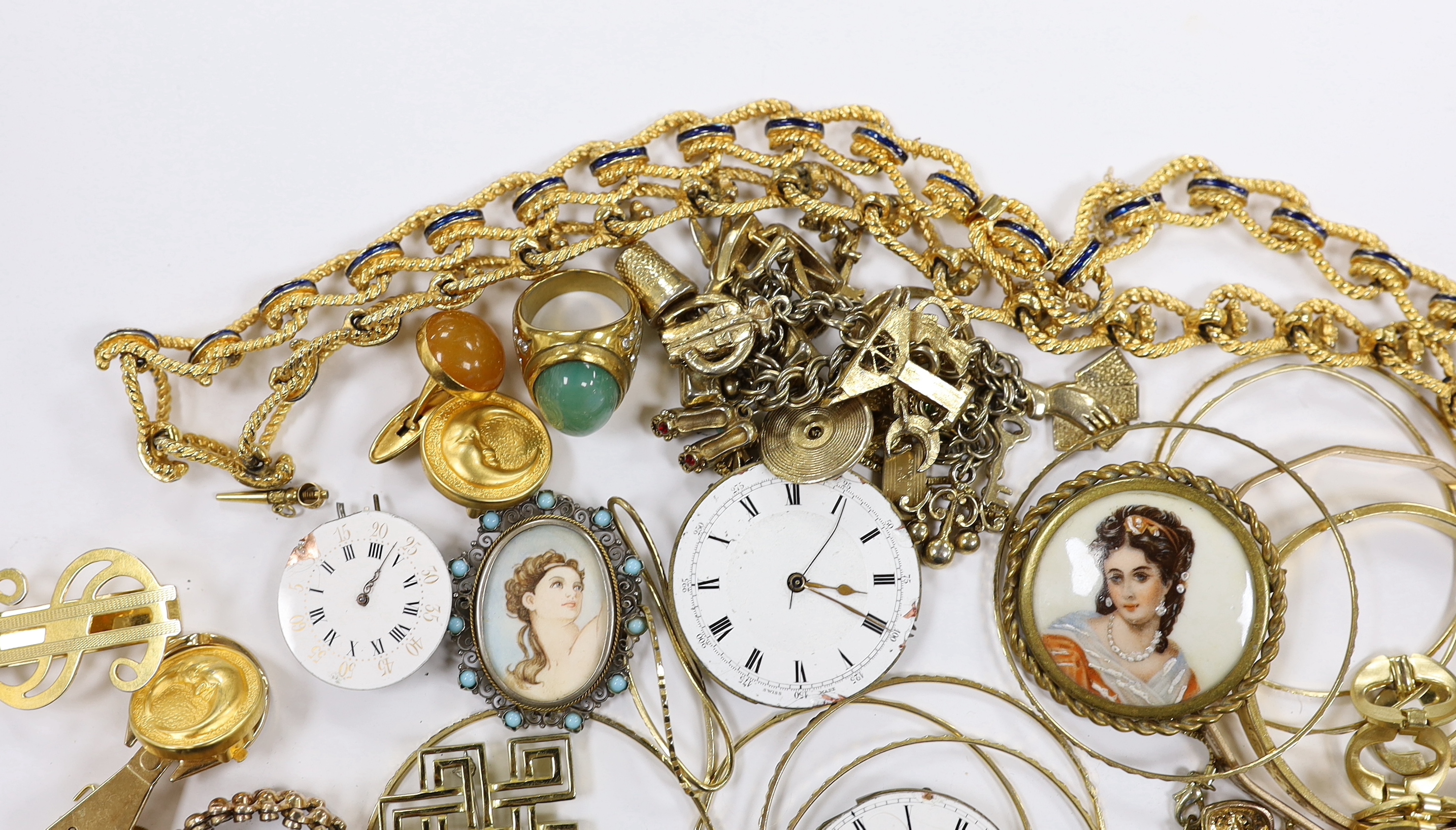 A small quantity of assorted gilt metal or gold plated jewellery, including large cub link necklace, bangles, bracelets, rings, cufflinks etc and three pocket watch movements.